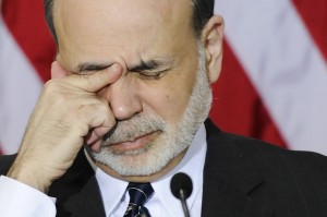 Bernanke rubs his eyes as he waits for the start of a meeting of the Financial Stability Oversight Council in Washington